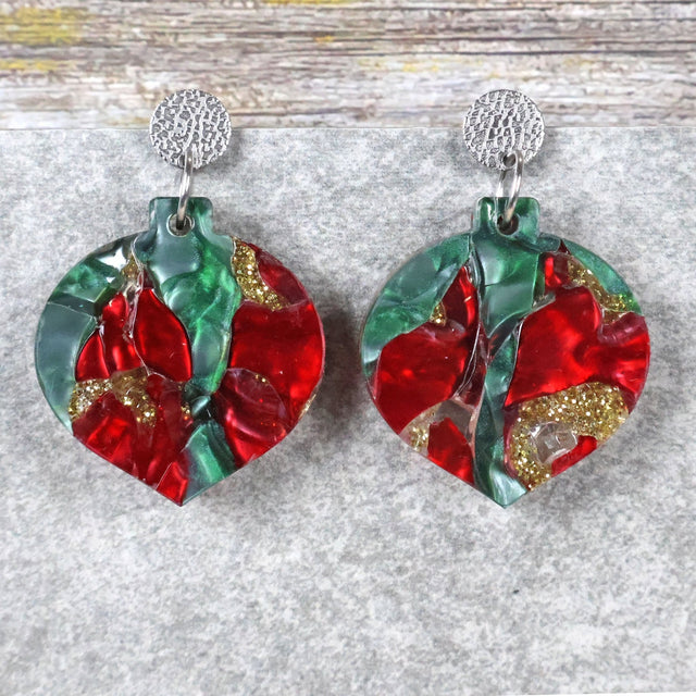 A pair of one of a kind recycled acrylic Christmas bauble earrings with stainless steel toppers, featuring a red, green and gold acrylic design. Pair 108-01