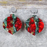A pair of one of a kind recycled acrylic Christmas bauble earrings with stainless steel toppers, featuring a red, green and gold acrylic design. Pair 108-06