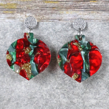 A pair of one of a kind recycled acrylic Christmas bauble earrings with stainless steel toppers, featuring a red, green and gold acrylic design. Pair 108-06