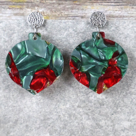 A pair of one of a kind recycled acrylic Christmas bauble earrings with stainless steel toppers, featuring a red, green and gold acrylic design. Pair 108-08