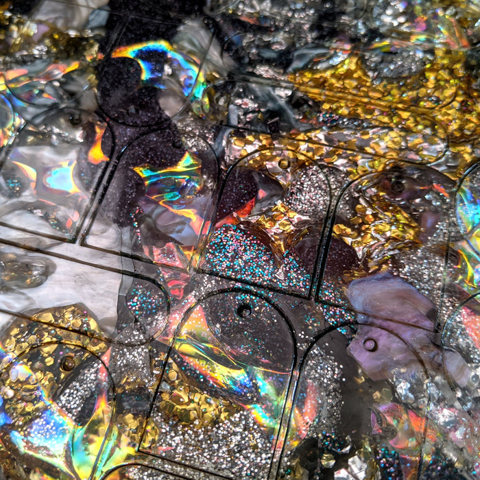 Recycled acrylic sheet with earring cutouts
