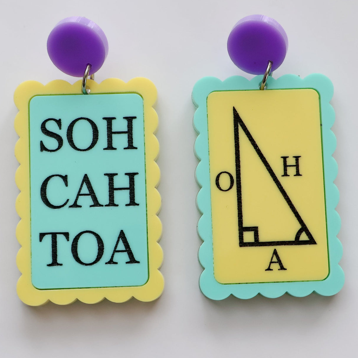 Asymmetrical earrings with 'SOH CAH TOA' and trigonometric triangle symbols in green yellow and purple tones