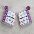 Science-themed texbook earrings with purple colour scheme