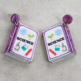 Science-themed texbook earrings with purple colour scheme