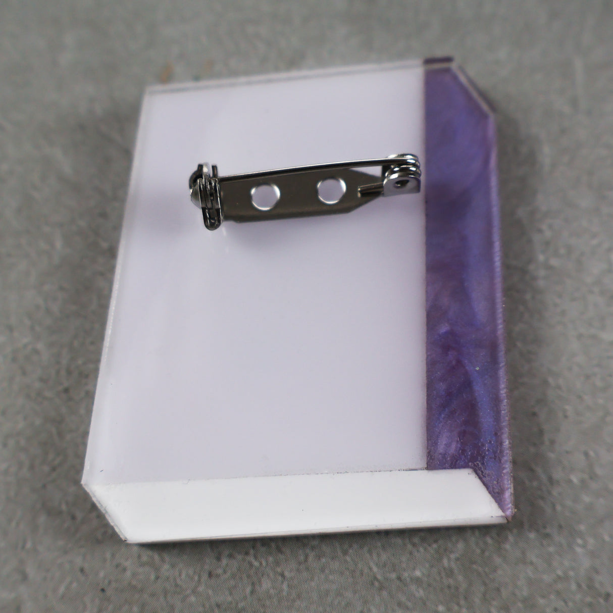 Back view of a Science textbook Acrylic brooch showing stainless steel brooch pin