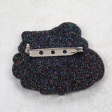 Black glittery brooch back view with a stainless steel brooch pin and rolling clasp. 