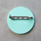 Teal brooch back showing stainless steel brooch pin and rolling clasp