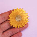 Swamp everlasting brooch in hand