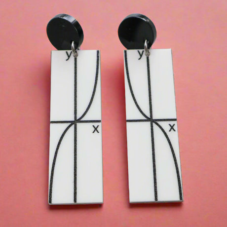 Pair of black and white earrings with tan graph design