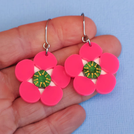 Tea tree merinda earrings in hand