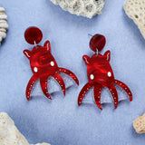 Laser cut acrylic vampire squid earrings, closeup.