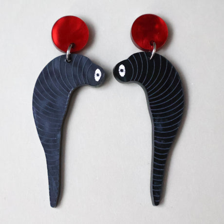 Pair of black acrylic leech shaped earrings with red tops