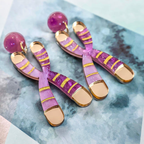 Side profile of Chromosome Earrings showing 28 mm chromosome pendants and matching acrylic toppers on comfort clutch nuts