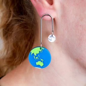 Front view of Earth and Moon Arch Earrings showing laser-engraved acrylic charms hanging from 304 stainless steel arches