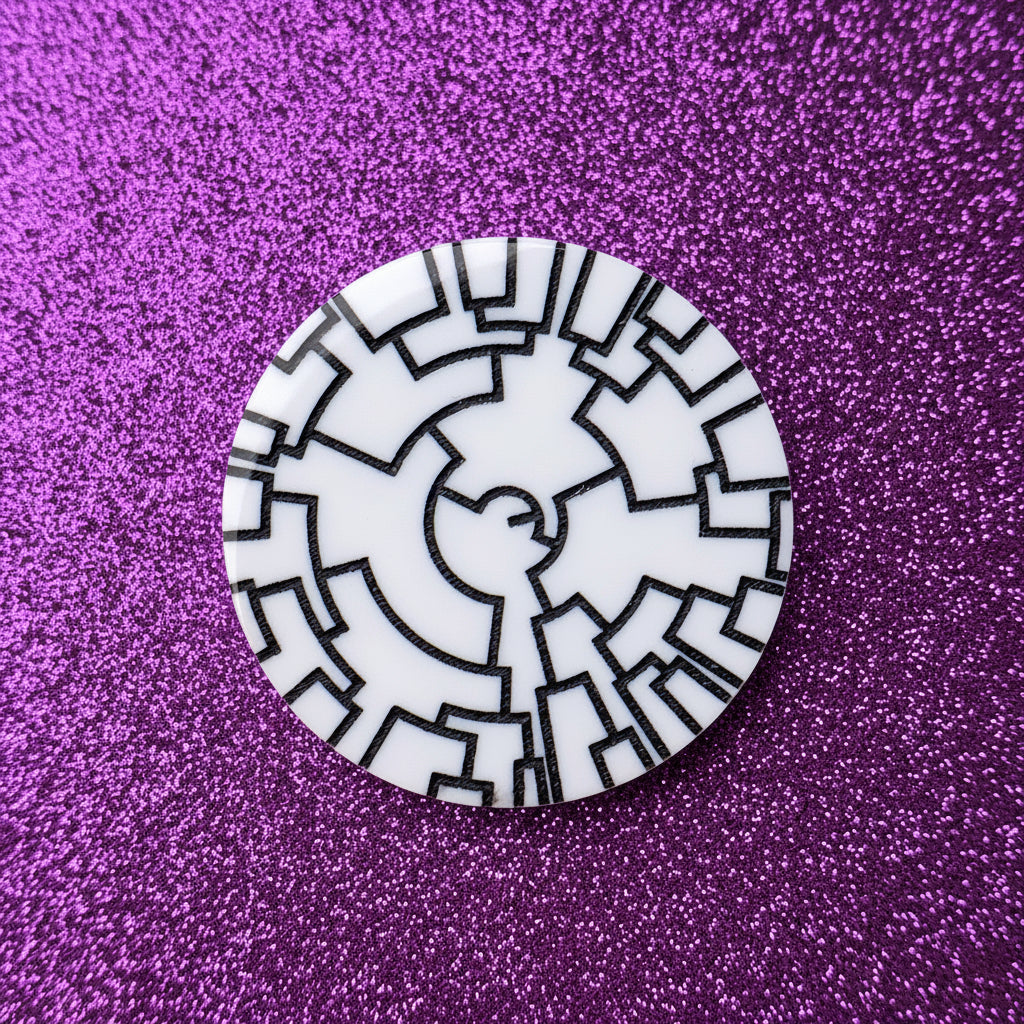 A phylogenetic tree acrylic brooch in black and white. 