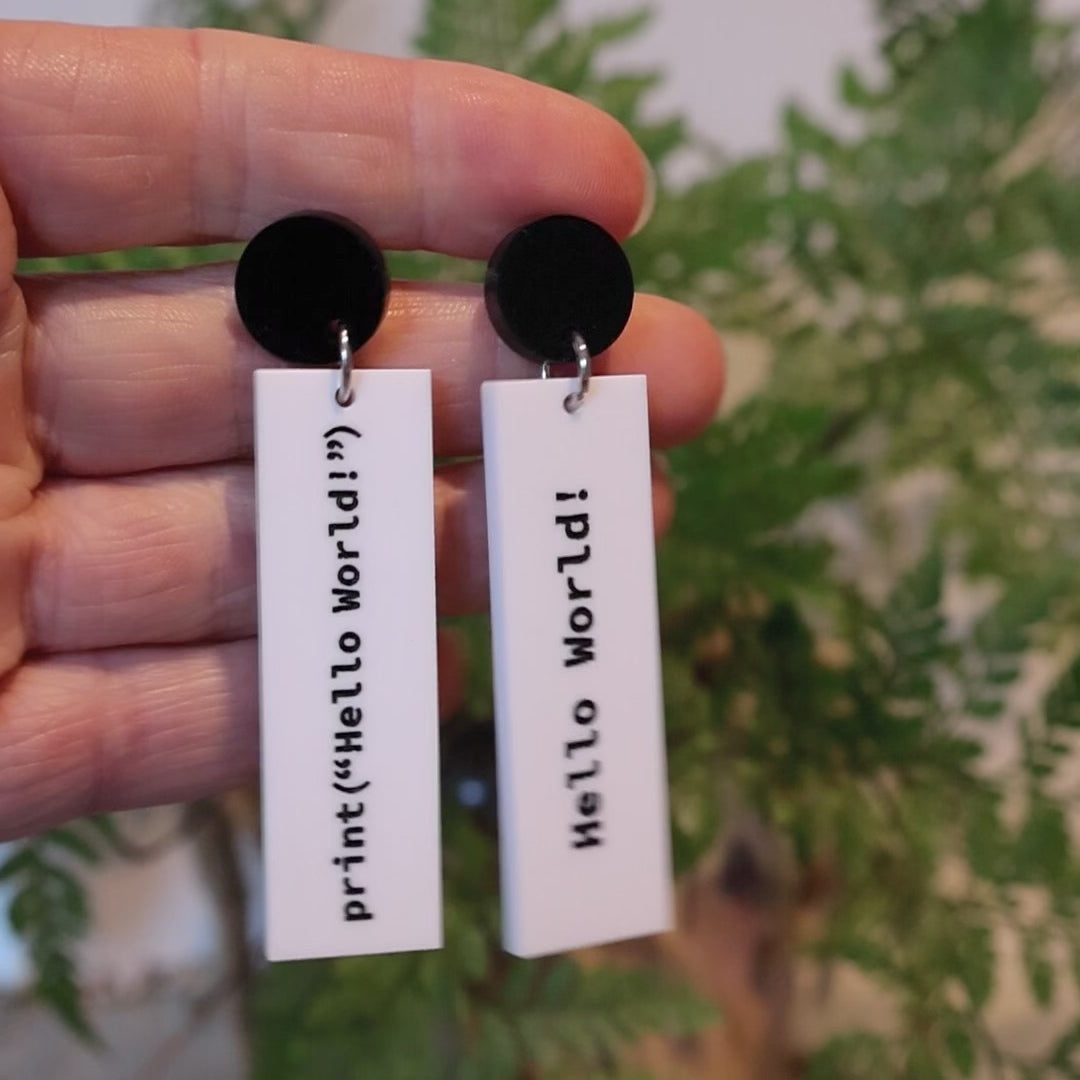 Closeup Video of Acrylic hello world programmer earrings by Oh Pluto