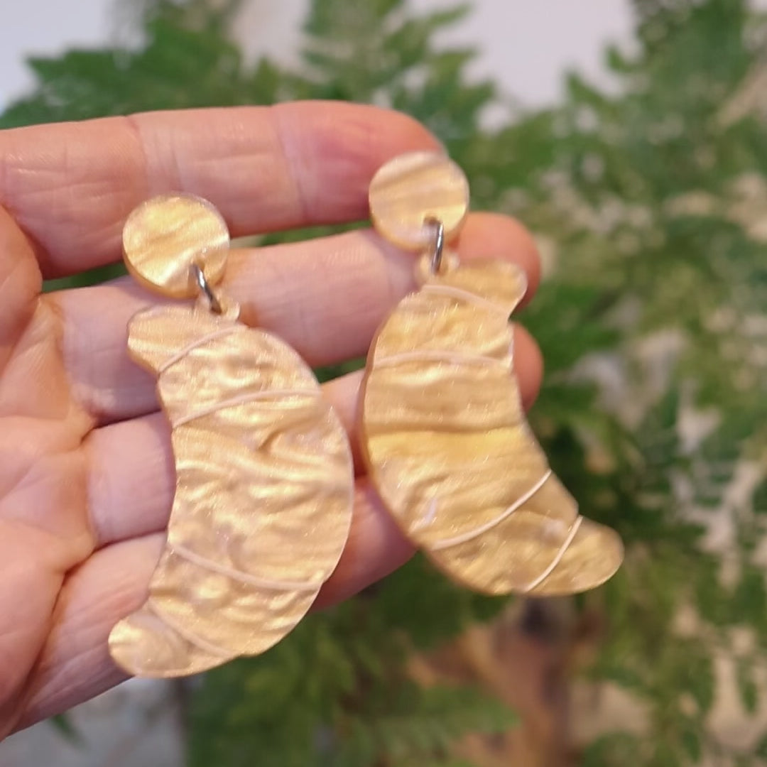 Closeup Video of Acrylic croissant earrings by Oh Pluto