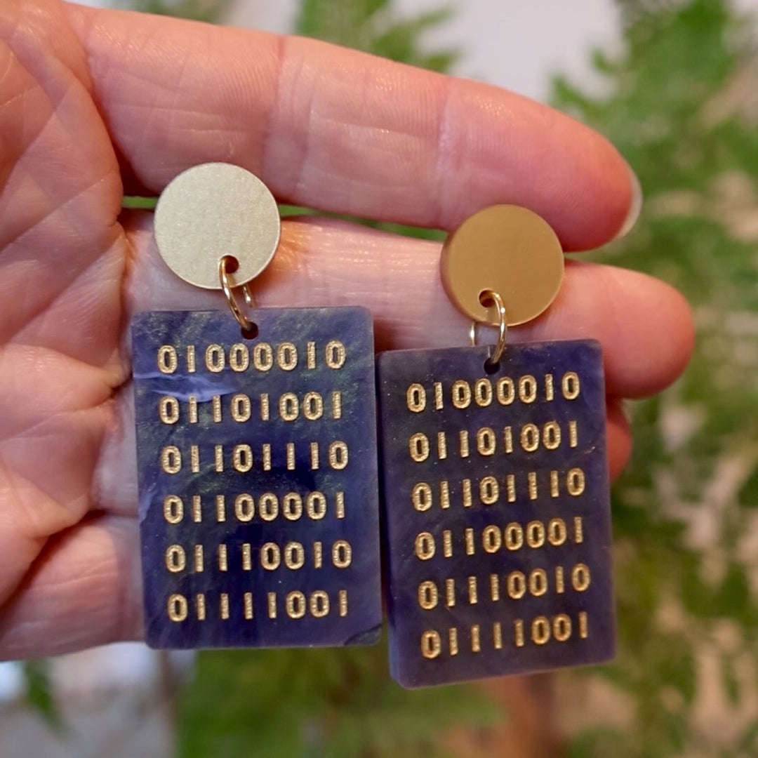 Closeup Video of Acrylic binary earrings by Oh Pluto