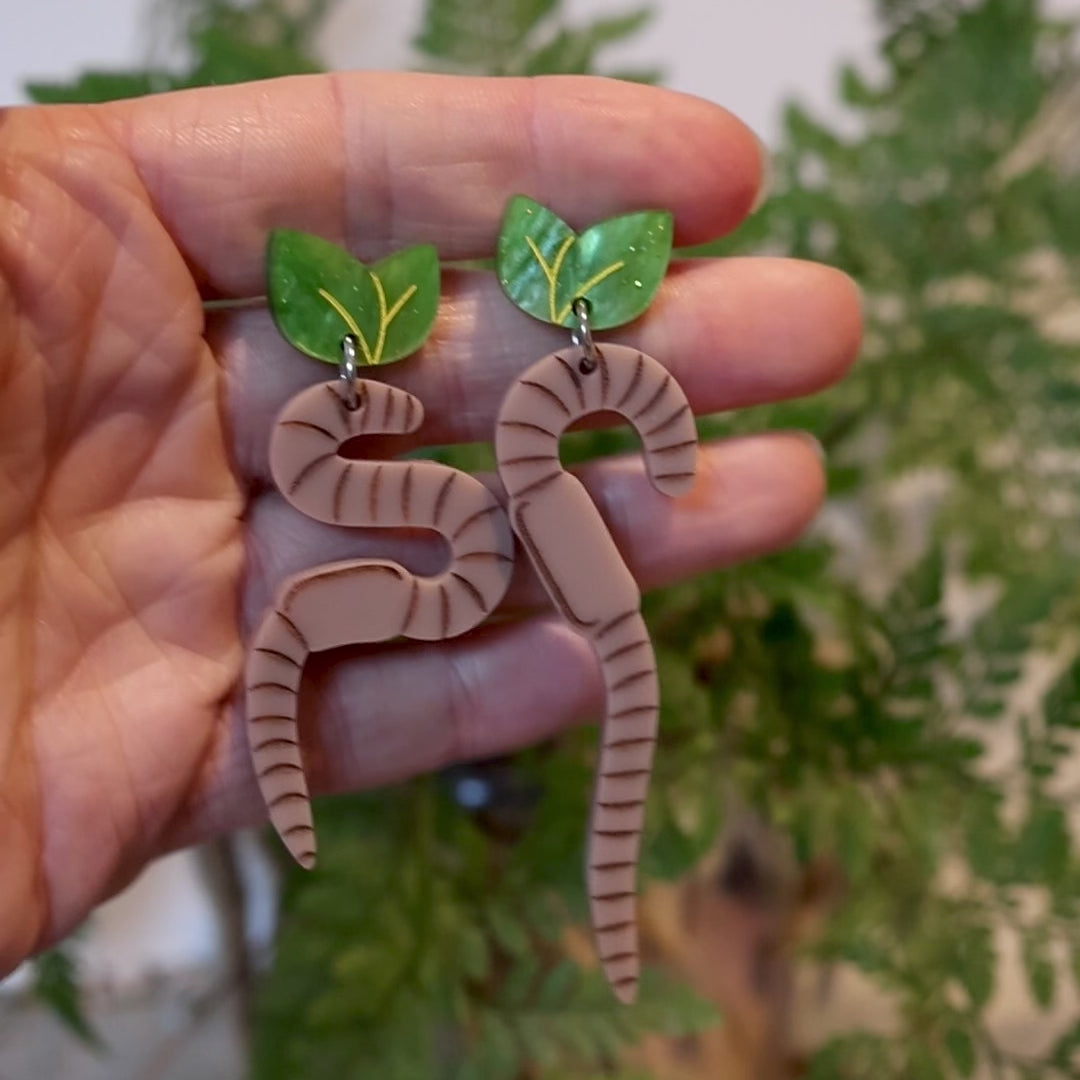 Closeup Video of Acrylic brown earthworm earrings by Oh Pluto