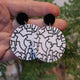 Closeup Video of Acrylic phylogenetic tree diagram earrings by Oh Pluto