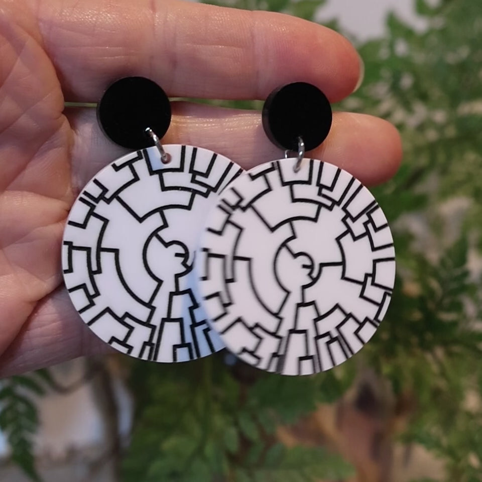 Closeup Video of Acrylic phylogenetic tree diagram earrings by Oh Pluto