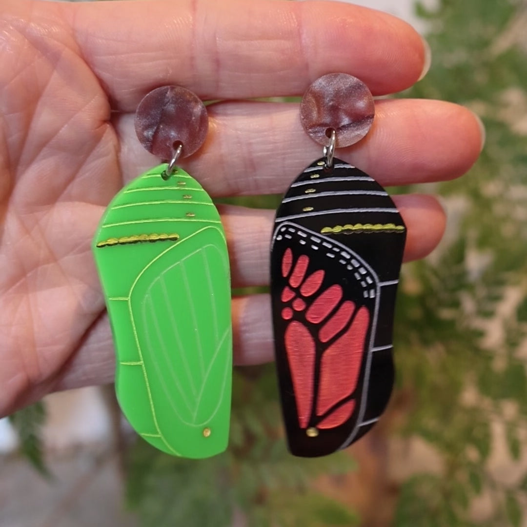Closeup Video of Acrylic monarch butterfly chrysalis earrings by Oh Pluto