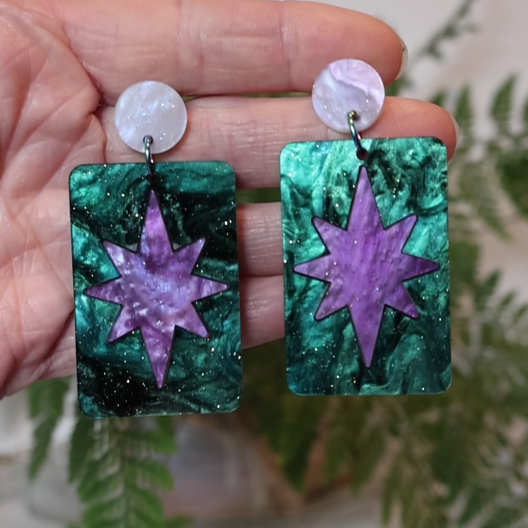 Closeup Video of Acrylic purple and teal star earrings by Oh Pluto