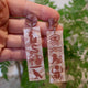 Closeup Video of Acrylic hieroglyphic earrings by Oh Pluto