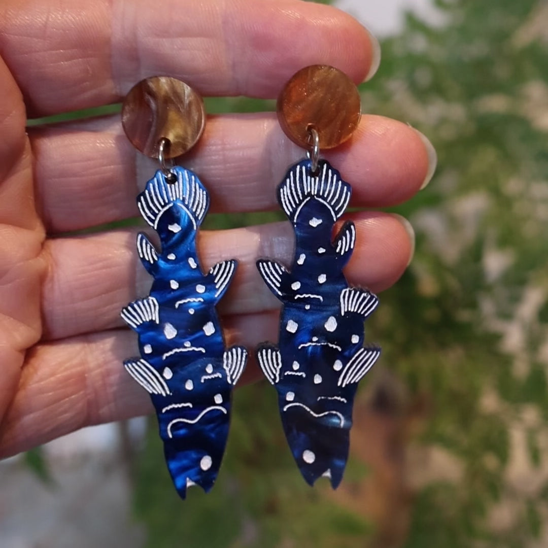 Closeup Video of Acrylic coelacanth earrings by Oh Pluto