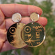 Closeup Video of acrylic Voyager Golden Record earrings by Oh Pluto