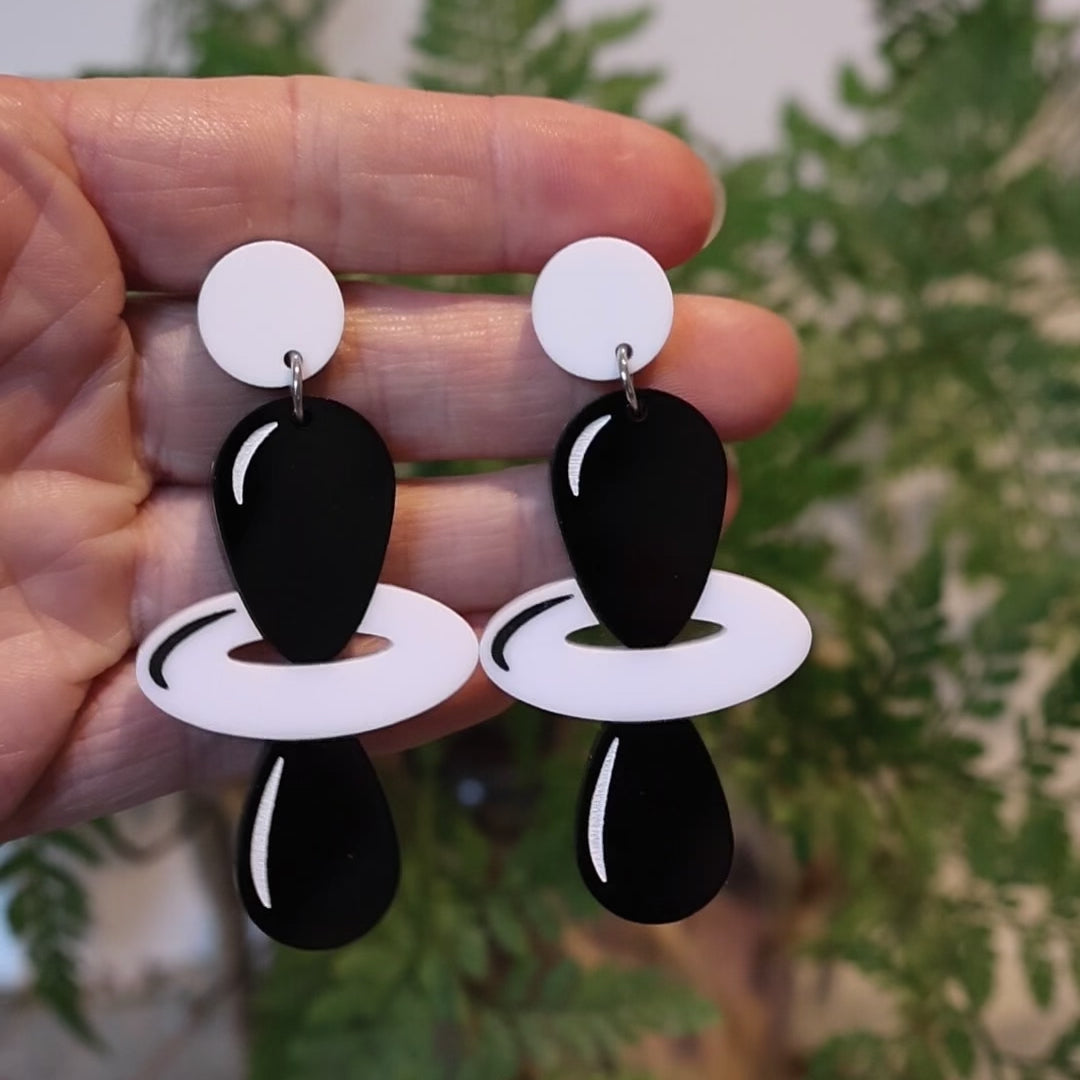 Closeup Video of Acrylic d orbital earrings by Oh Pluto
