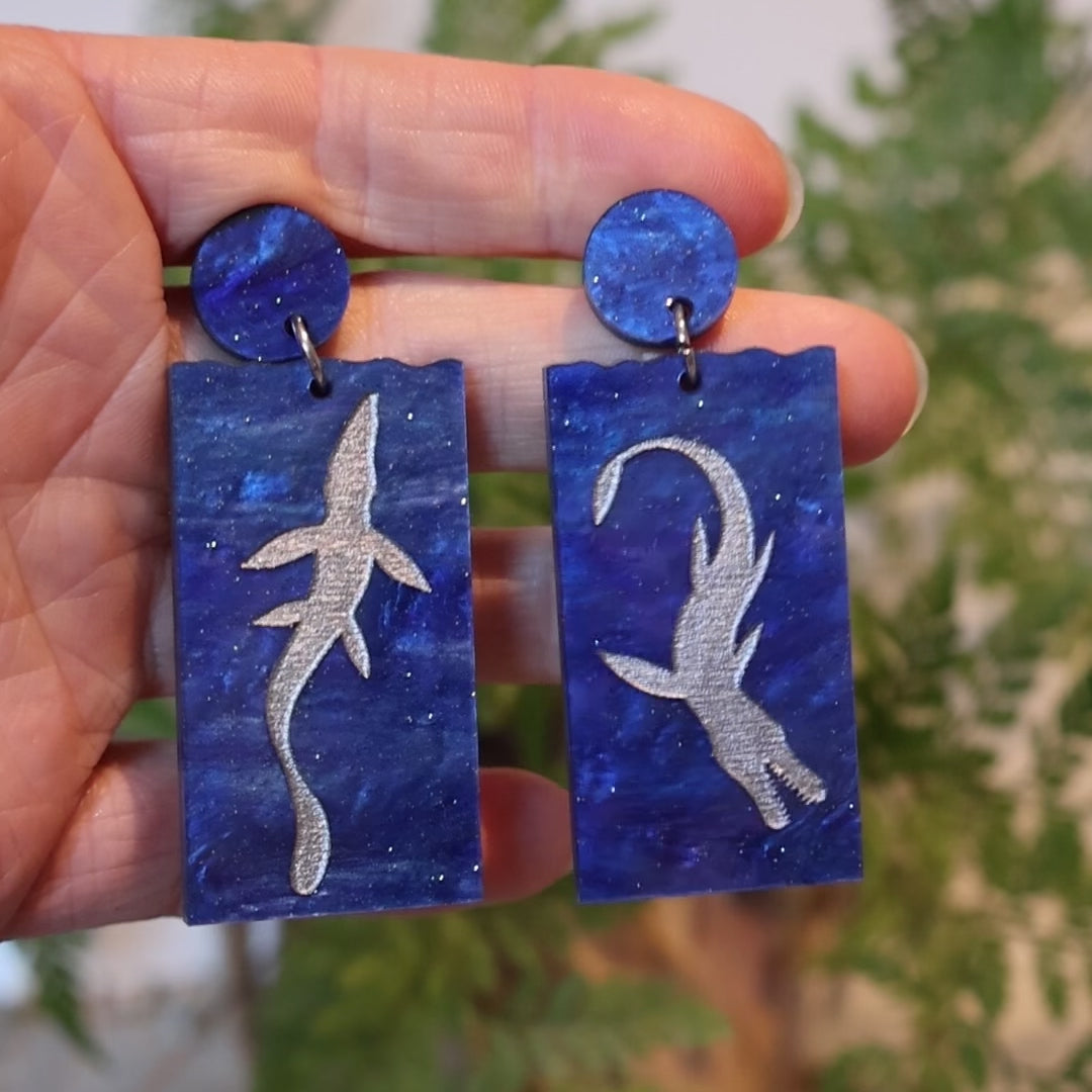 Closeup Video of Acrylic plesiosaur earrings by Oh Pluto