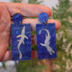 Closeup Video of Acrylic plesiosaur earrings by Oh Pluto