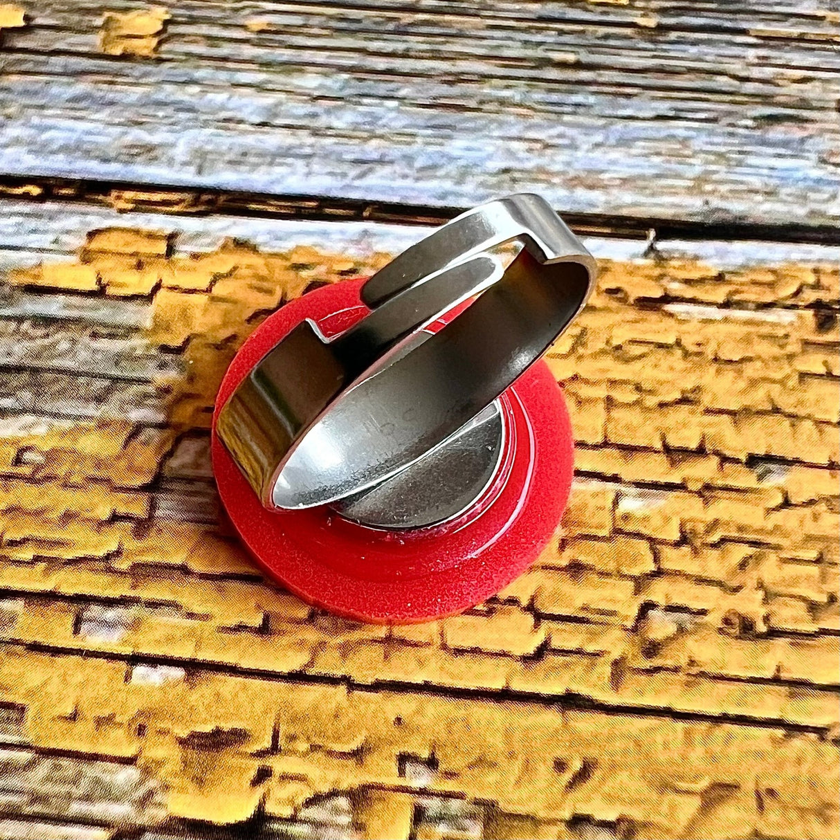 back view of acrylic red blood cell ring with adjustable stainless steel ring component