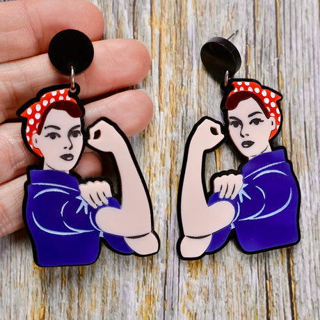 Rosie the Riveter Earrings in light skin tone with brown hair, laser cut acrylic on black toppers in hand
