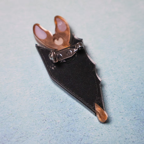 Back view of a vampire bat brooch
