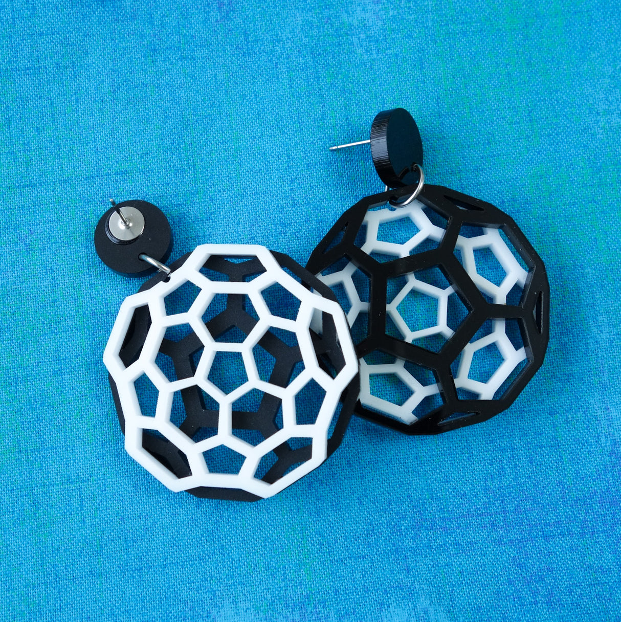 Black and white bucky ball earrings in laser cut acrylic