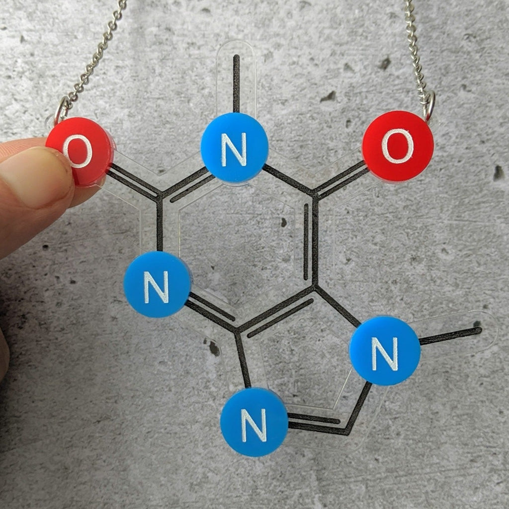 Caffeine Molecule Necklace in Laser Cut Acrylic closeup. With Oxygen red oxygen and blue nitrogen components. 