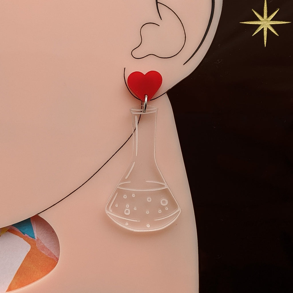 Laser Cut Acrylic Clear Conical Flask Earrings with Red Heart Earring Toppers. Chemistry Glassware Earrings. Modelled. 