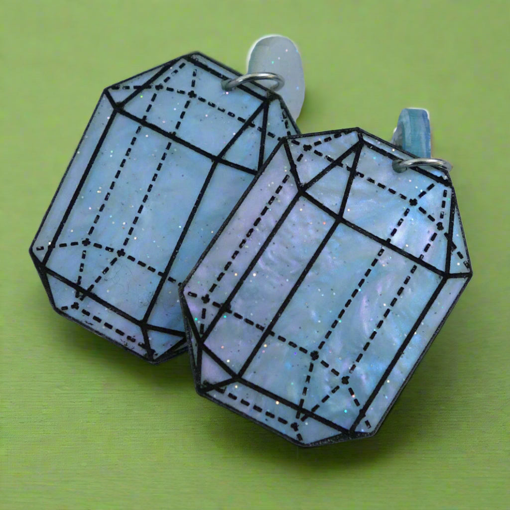 Close up image of variation 5 in crystal design laser cut acrylic earrings. 