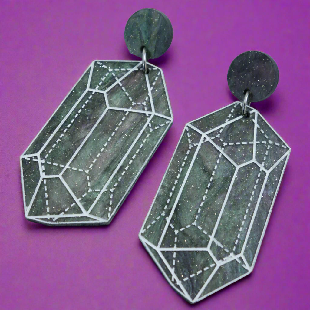 Close up image of variation 1 in crystal design laser cut acrylic earrings.