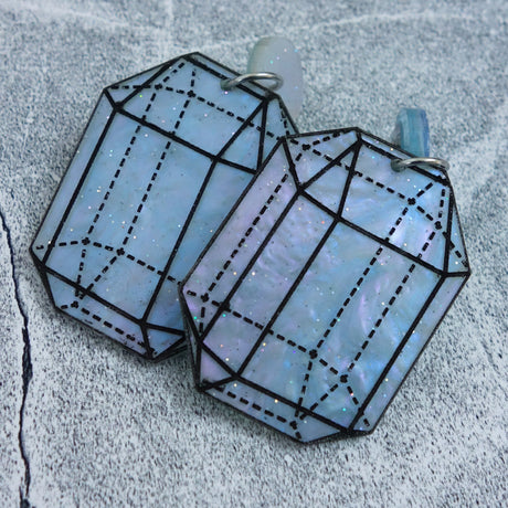 Close up image of variation 5 in crystal design laser cut acrylic earrings. 