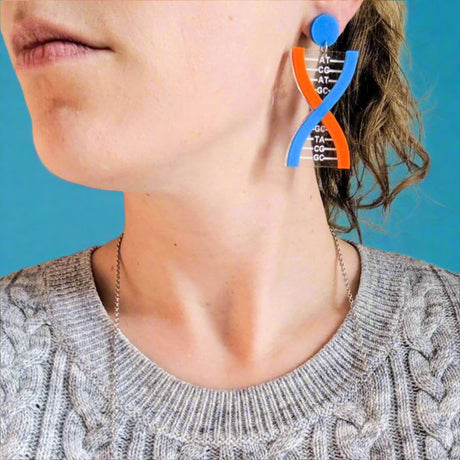 Blue and Orange DNA Acrylic Earrings being modelled.