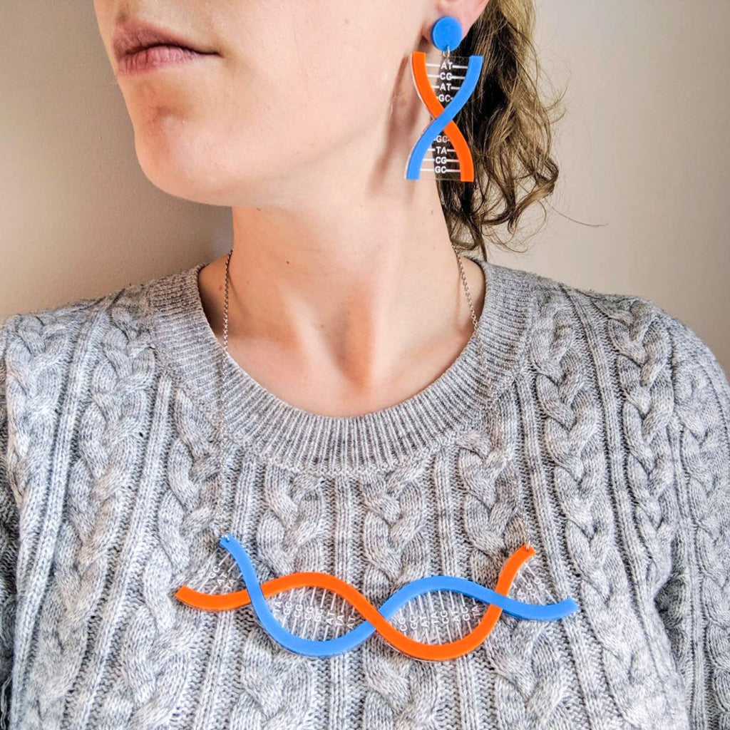 Blue and Orange DNA Acrylic Earrings and DNA Acrylic Necklace being modelled.