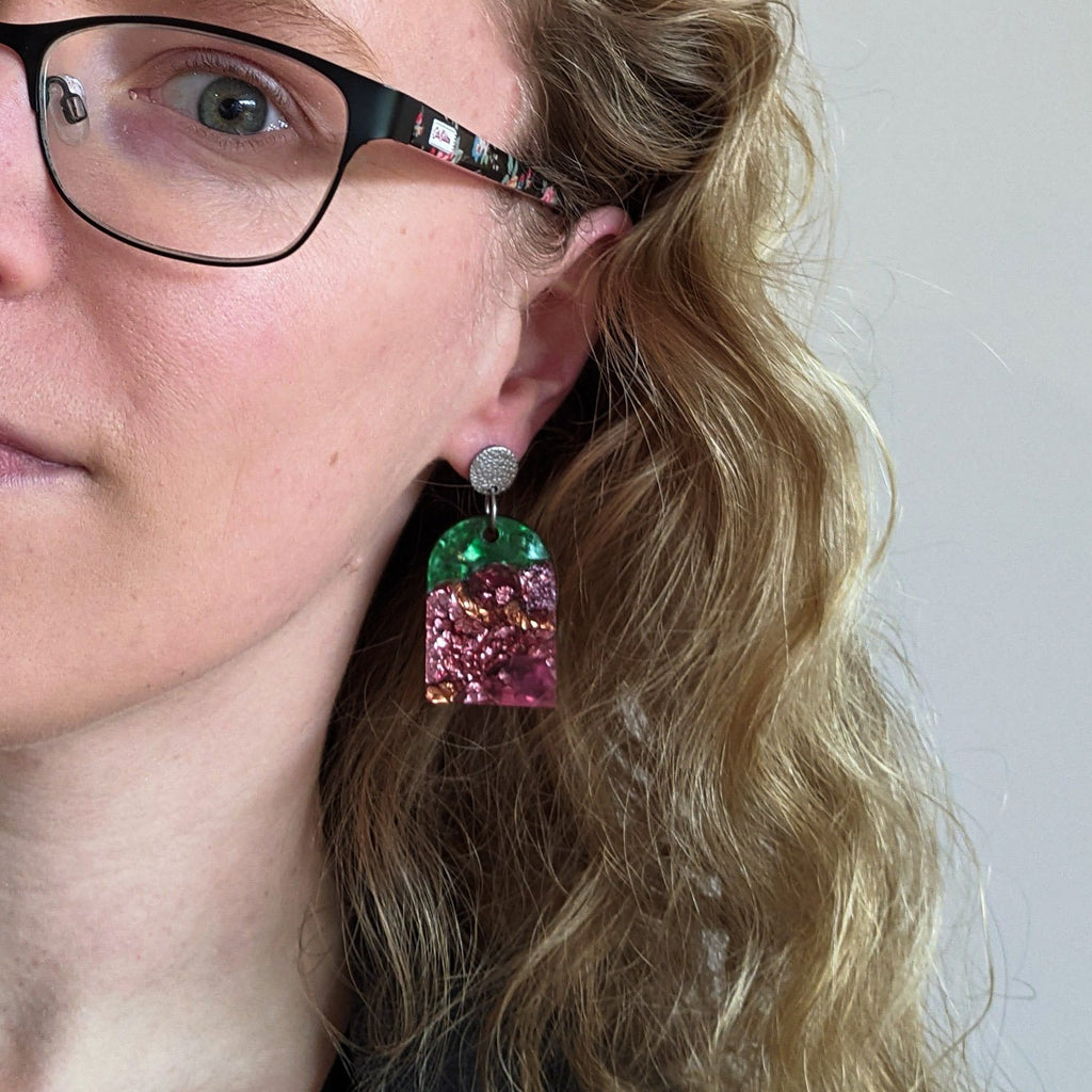 Large Arch Shaped Recycled Acrylic Earrings Being Modelled