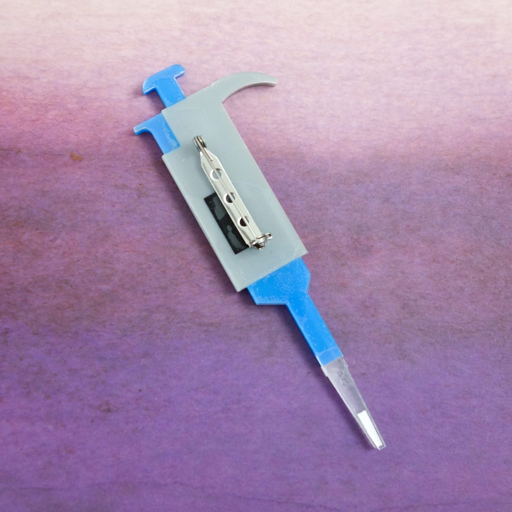 Laser Cut Acrylic Micropipette Brooch in Blue and Grey Colours. Showing Brooch Back. Scientific Instrument Brooch. 