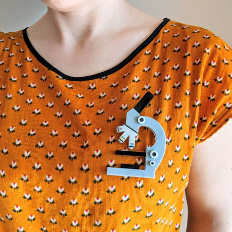 Laser Cut Acrylic Large Statement Microscope Brooch being Modelled. 