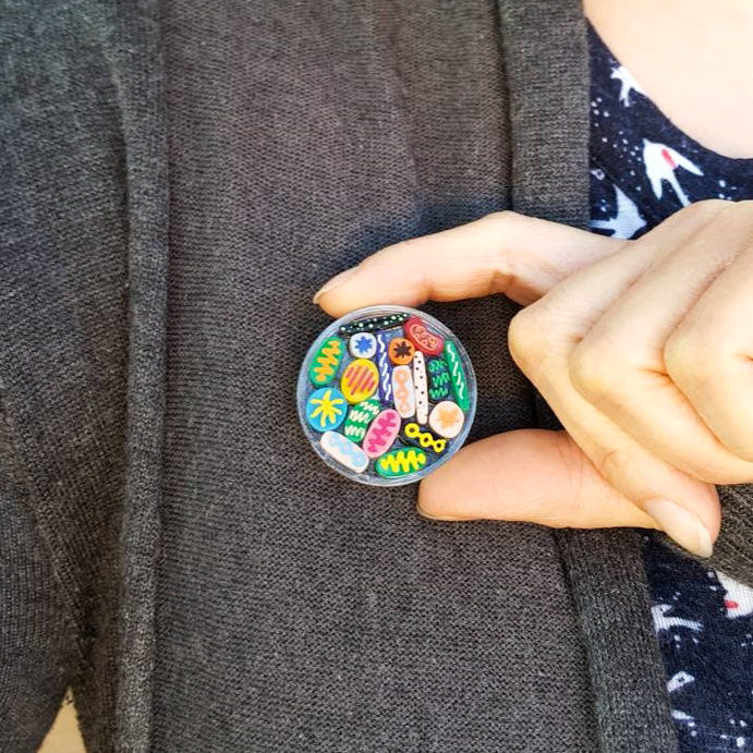 Laser cut acrylic small Petri Dish Brooch with acrylic microbes. 