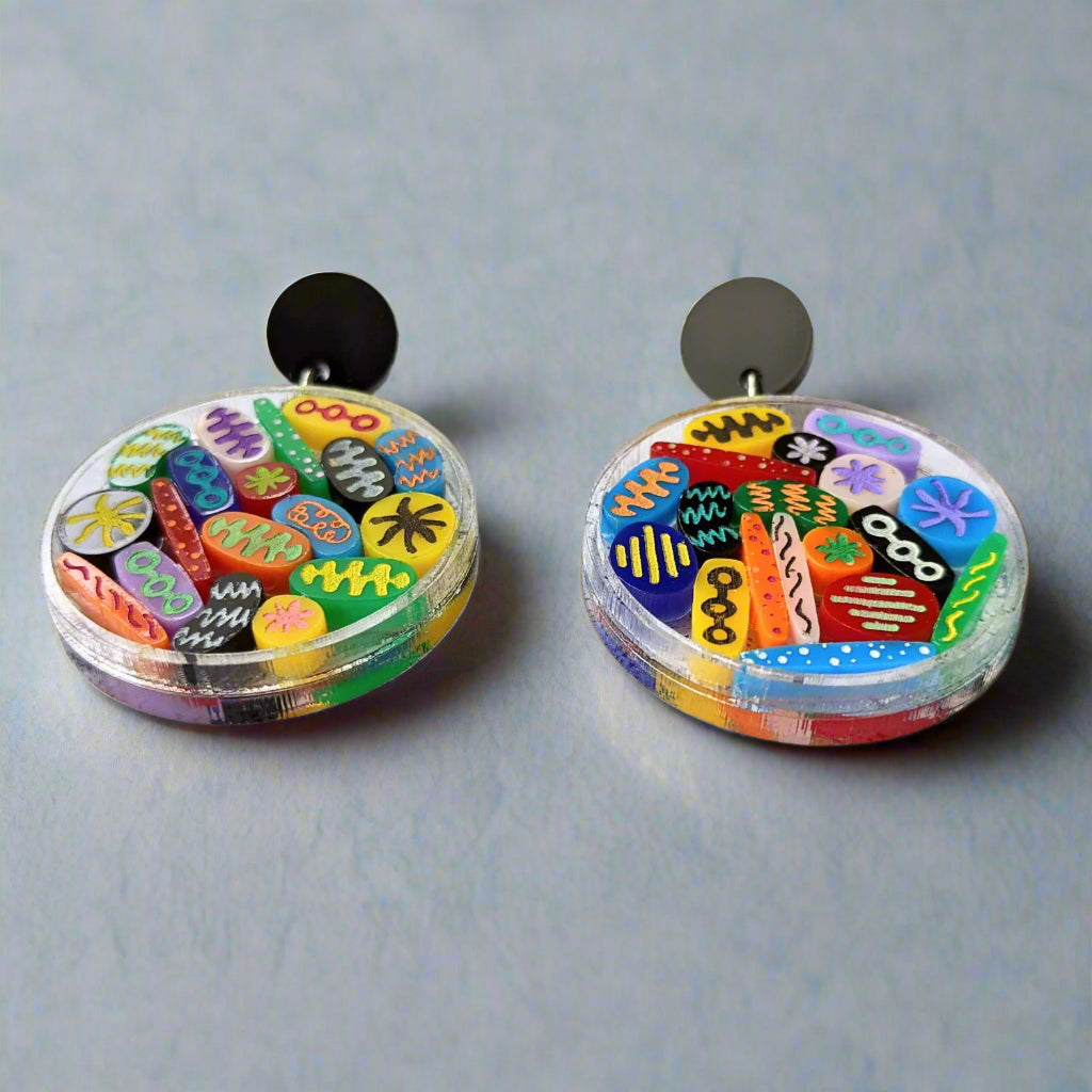 Petri Dish earrings with tiny acrylic microbes. Laser cut in acrylic. 
