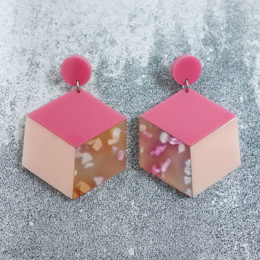 Laser cut acrylic statement cube earrings in pink colourway. 
